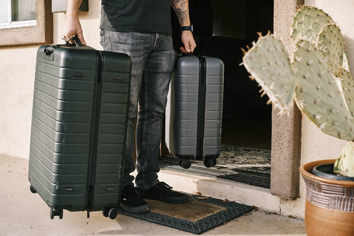 Polycarbonate vs aluminum luggage durability — colorful polycarbonate hard-shell suitcases stacked