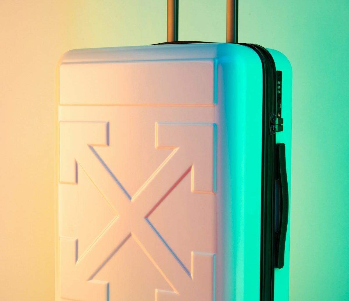 Best aluminum luggage brands — polished aluminum hard-shell suitcase with signature grooves