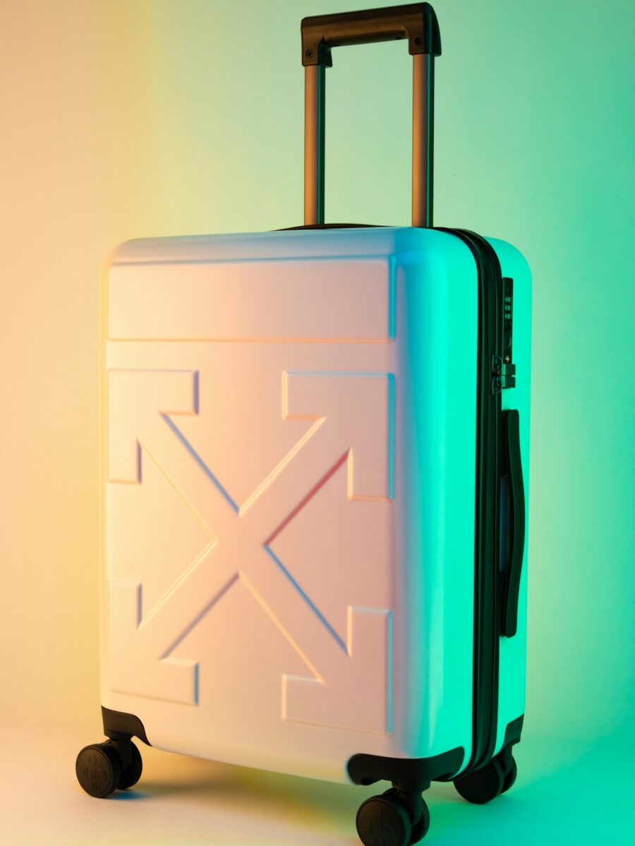 Best aluminum luggage brands — polished aluminum hard-shell suitcase with signature grooves