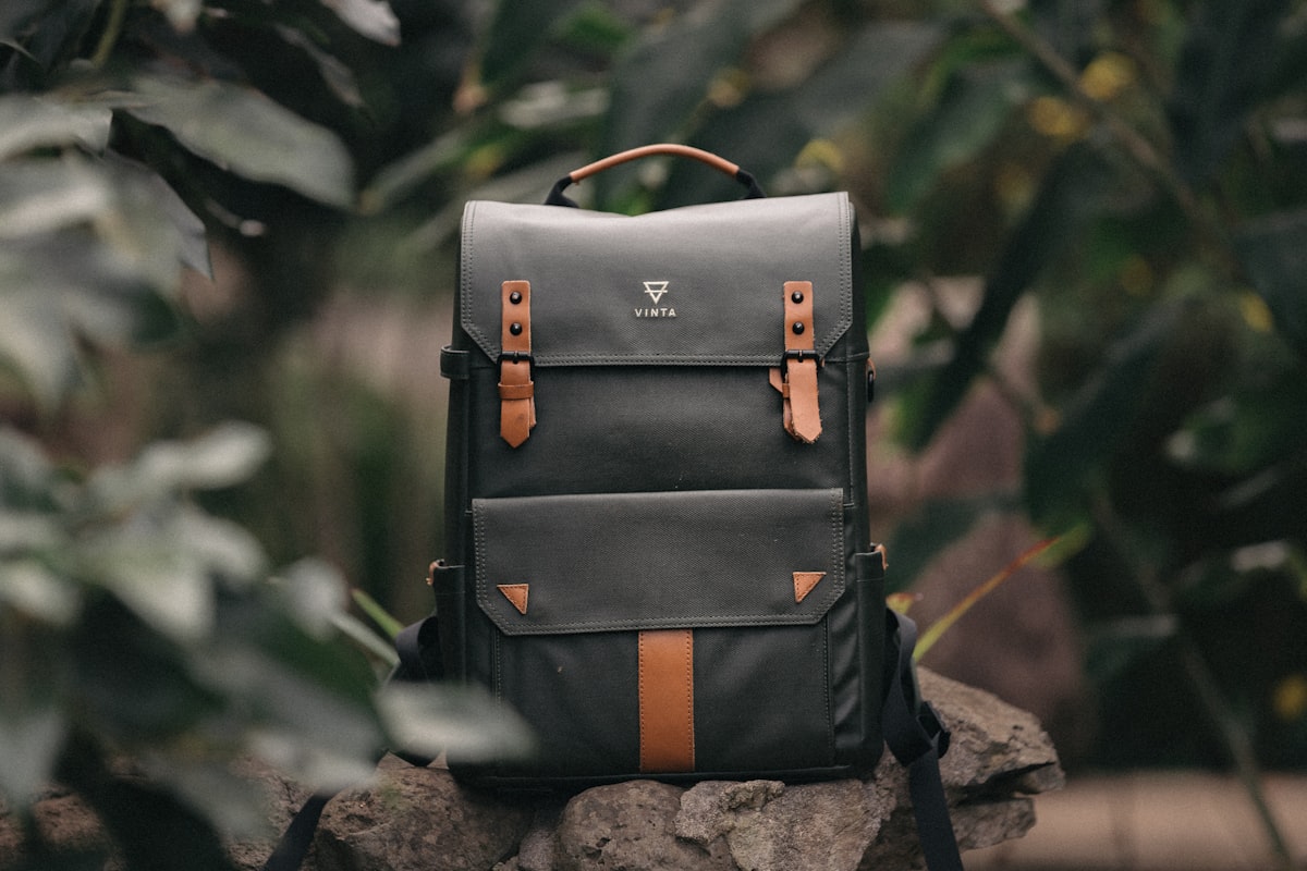Best aluminum luggage brands — close-up of aluminum suitcase handle and latching mechanism