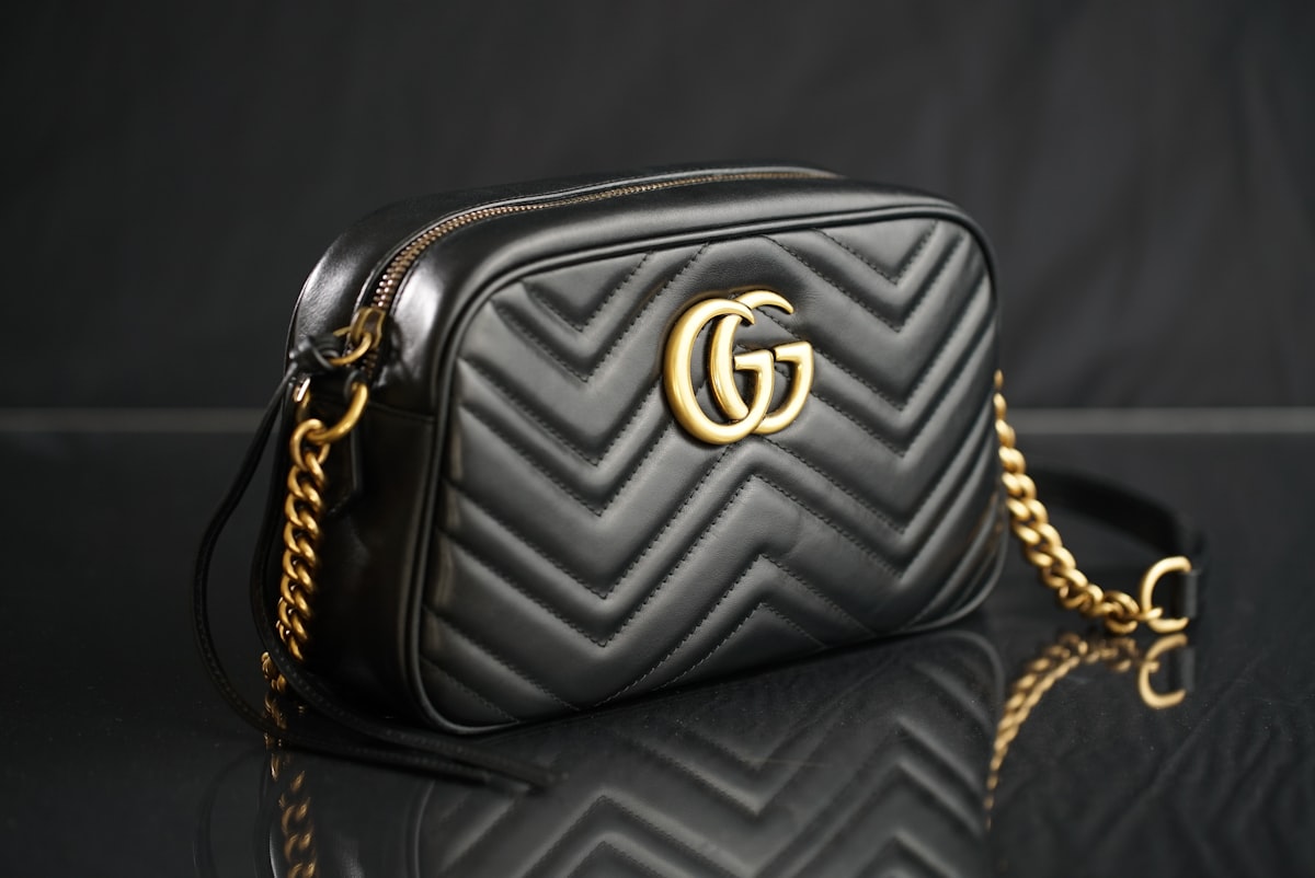 Minimalist luxury leather bags — structured leather bag on neutral background