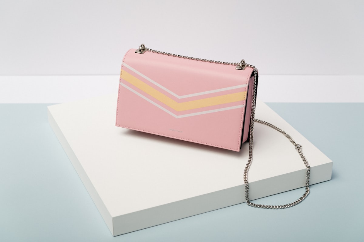 Quiet luxury bags — understated leather shoulder bag in stone beige