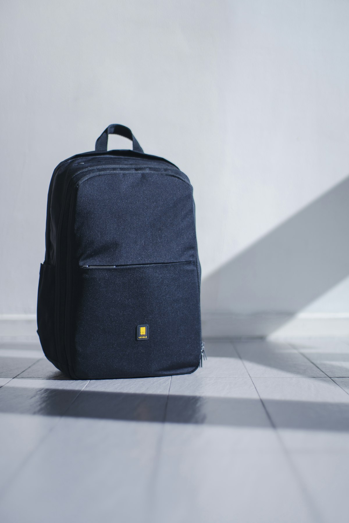 Luxury leather duffel bags for travel — structured calfskin weekend bag open on a bed
