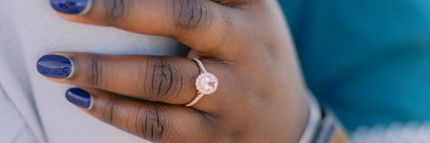Diamond engagement ring with a prong setting on a hand