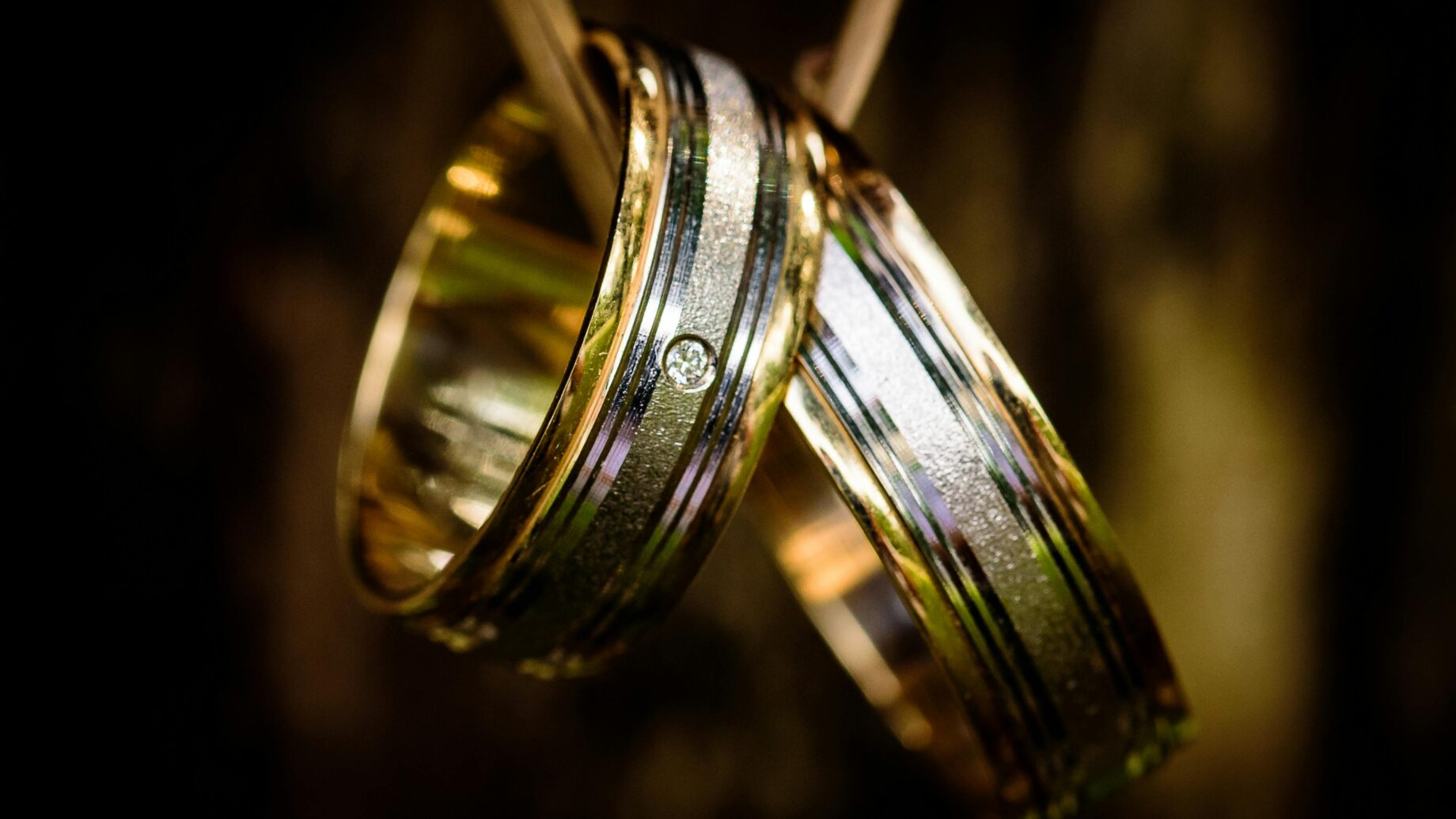Matching gold wedding band paired with a diamond engagement ring